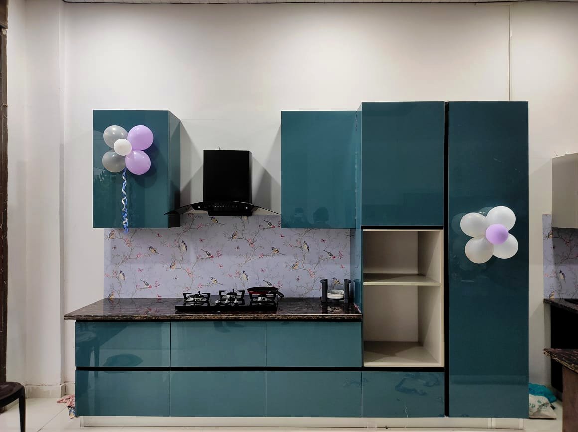 Navy blue luxury island modular kitchen by Sarvadnya